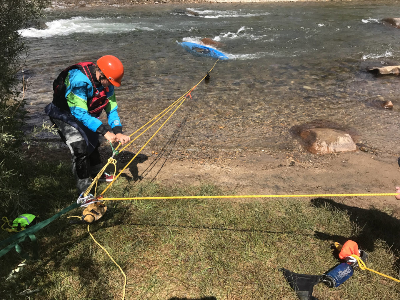 Pulling kayak in with pulley during swift water rescue training