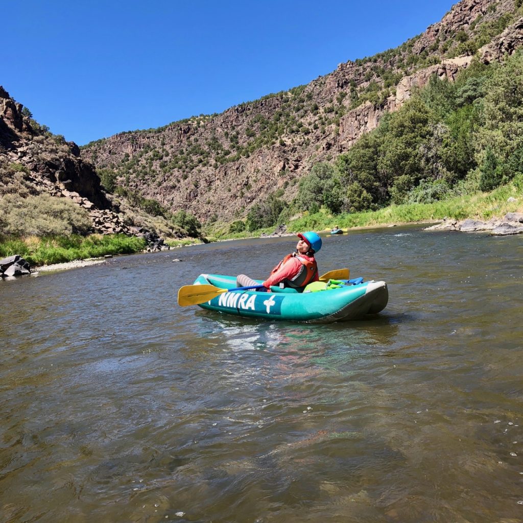 women in an inflatable kayak