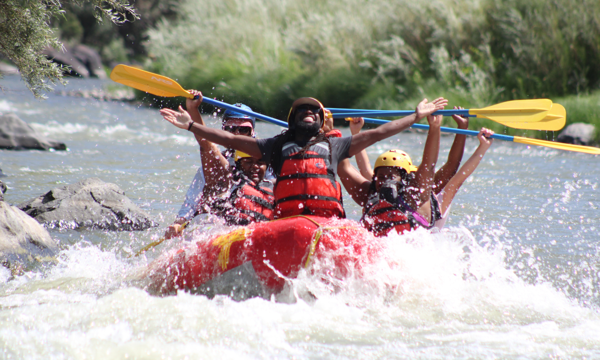 group of people whitewater rafting